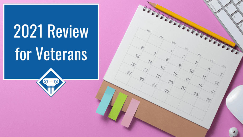 Photo of a calendar lying on a pink background with colorful sticky notes stuck to the bottom left side. Article title is in the upper lefthand corner: 2021 Review for Veterans.