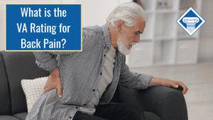 A man with white hair in a grey button down sits on a couch and holds his back with an uncomfortable look on his face. Over the image is a blue box reading the article title" What is the VA rating for back pain?"
