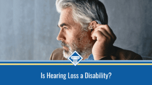 Image of a man adjusting his hearing aid. The title of the article, "Is Hearing Loss a Disability" is placed inside a blue bar that stretches across the bottom of the image.