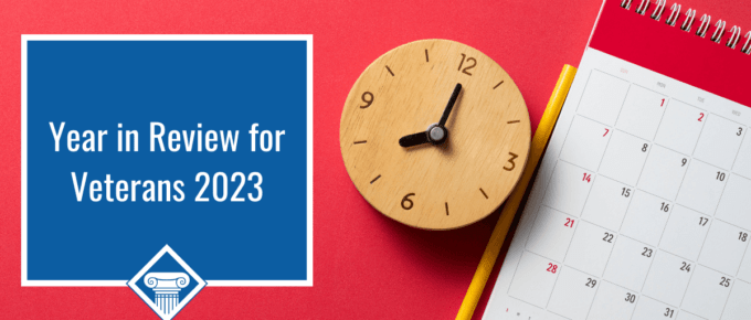 A wooden clock, a pencil, and a calendar are shown on a red background, with the article title to the left: Year in Review for Veterans 2023.