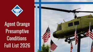 An image of a helicopter and U.S. flags against a blue sky at a Vietnam War memorial. Alongside the image is a red banner reading the article title: Agent Orange presumptive conditions full list 2026