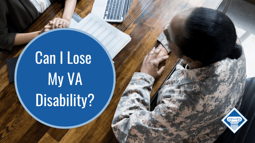 A person in uniform sitting across from a person on a computer at a desk. Over the image is a bubble that reads the FAQ title: Can i lose my VA Disability?