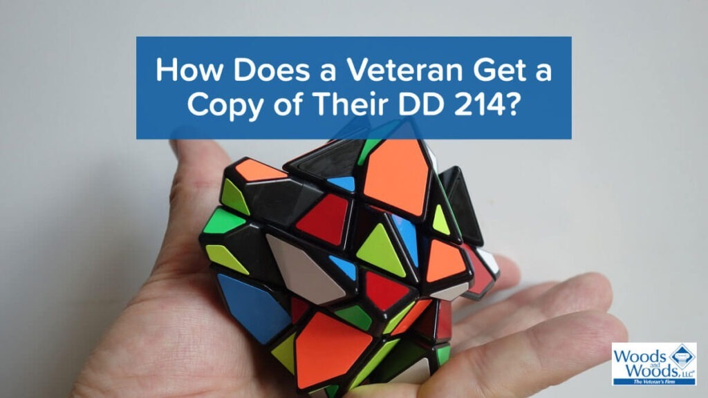 Picture of a complicated puzzle with article title above it: How Does a Veteran Get a Copy of Their DD 214? Woods and Woods logo is in the bottom right.