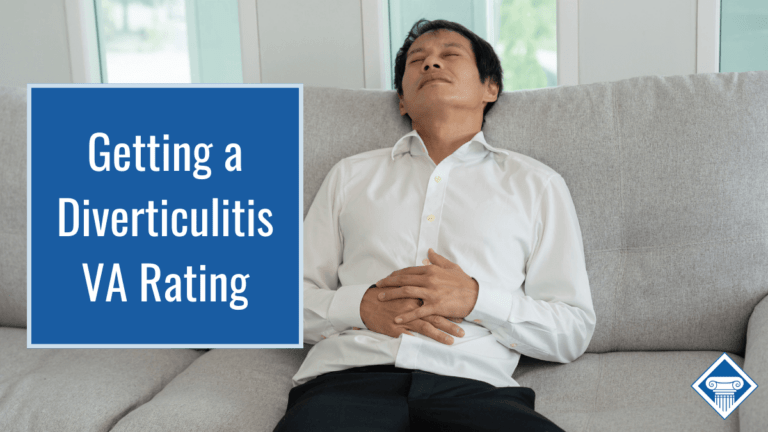 Man slouches on a gray couch with his hands on his stomach in pain. Article title to the left: Getting a Diverticulitis VA Rating