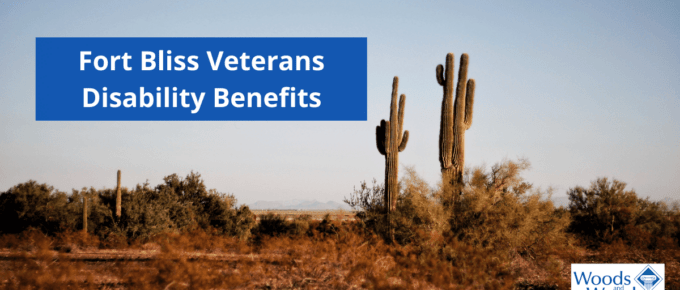Image of two cacti in the desert with our title: Fort Bliss Veterans Disability Benefits on the upper left side. The Woods and Woods logo is in the bottom right corner.