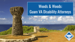 Photo of an ancient latte stone overlooking the Pacific ocean in Guam. Article title is in a blue box in the top right of the image: "Woods & Woods: Guam VA Disability Attorneys"