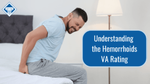 Photo of a man wearing a light blue shirt sitting on the edge of a bed grimacing in pain while holding his bottom. Article title is to the right: Understanding the hemorrhoids VA rating.
