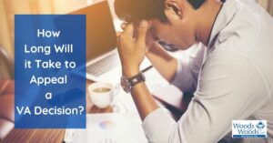 Man reading and working with coffee while waiting for the VA to appeal their decision.