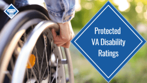A person's hand rests on a wheelchair wheel. Over the image is a blue diamond reading the article title: Protected VA disability ratings