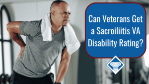 An image of a man in a gym with a towel hanging around his neck and a grey tshirt on. The man is holding his lower back, slightly bending forward. Over the image is a blue box reading the article title: Can veterans get a sacroiliitis VA disability rating