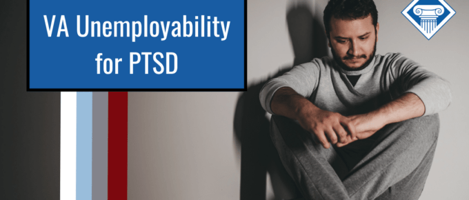 Man is sitting in the corner of a room on the ground holding his hands together and looking down. Article title is on the left: VA Unemployability for PTSD.