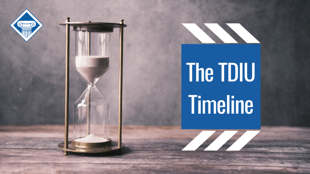 An image of an hourglass on a wooden table. Over the image is the Woods and Woods logo and a box with the article title: The TDIU Timeline