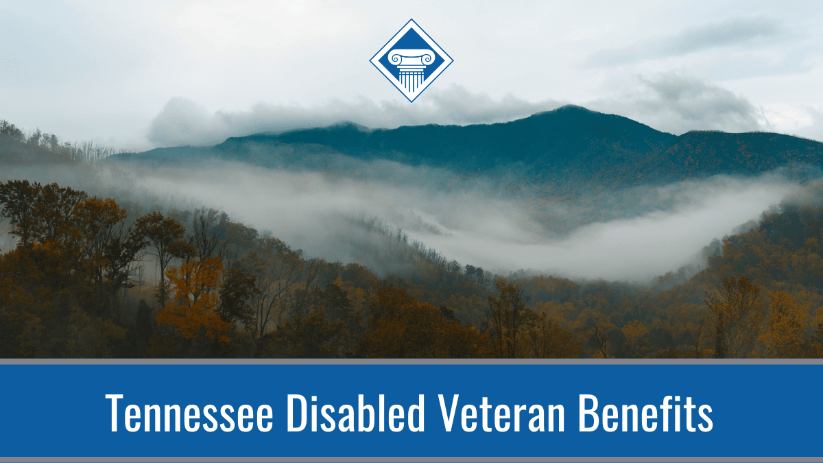An image of a blue ridge mountain shrouded in mist, with fall trees in the foreground. Along the bottom of the image is a blue banner reading the article title: Tennessee Disabled Veteran Benefits