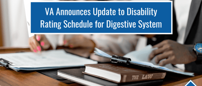 Picture of two people sitting at a desk with clipboards and books. Article title near the top: VA Announces Update to Disability Rating Schedule for Digestive System