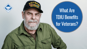 A veteran looking at the camera and giving a small smile. He is wearing a green shirt and a Vietnam Veteran hat. Over the image is the article title: What are TDIU benefits for veterans?