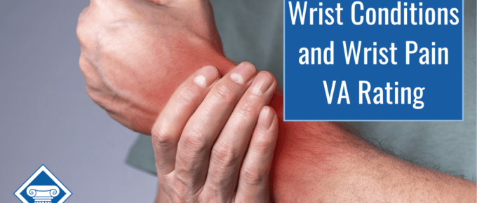 A person is holding their wrist with their opposite hand. Wrist is highlighted in red to show pain. Article title in righthand corner: Wrist Conditions and Wrist Pain VA Rating