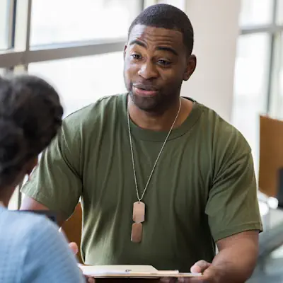 Soldier talking to a doctor.