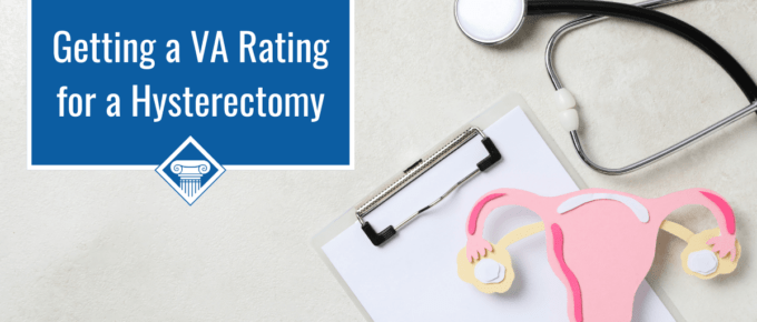 Picture of a stethoscope, a clipboard with paper, and a paper cut out of a woman's reproductive system with the article title to the left: Getting a VA Rating for a Hysterectomy