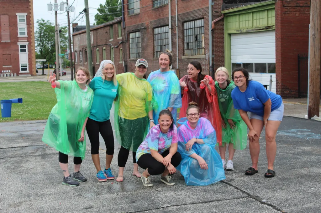 Team gathered for a water balloon fight.