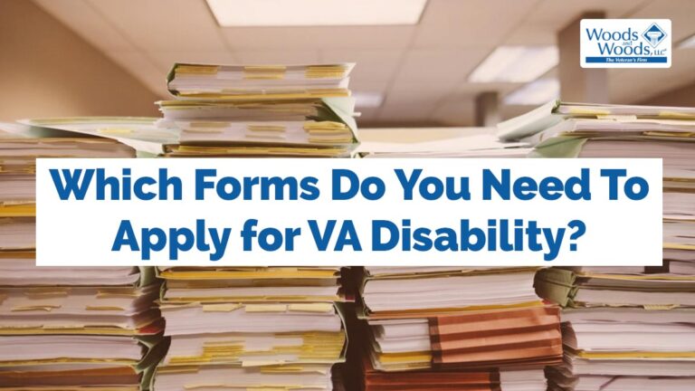 stacks of many papers and books with notes and bookmarks sticking out of them in a library or an office. Our title is in front: Which Forms do you need to apply for VA disability?